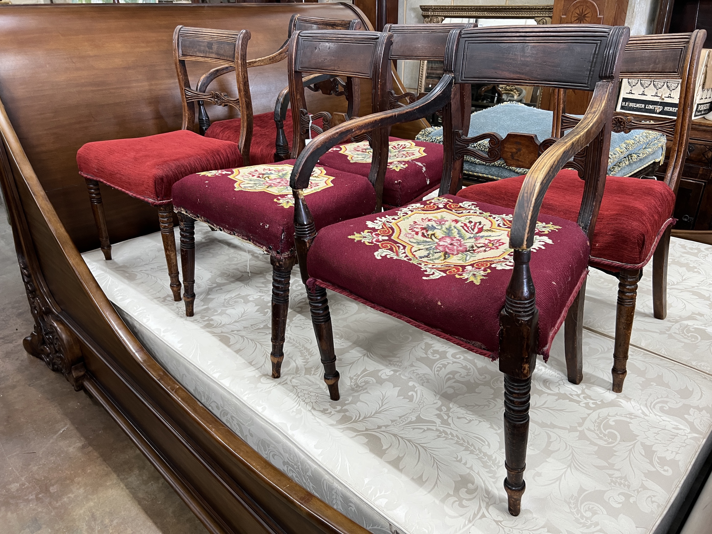 A harlequin set of six Regency mahogany dining chairs, two with arms